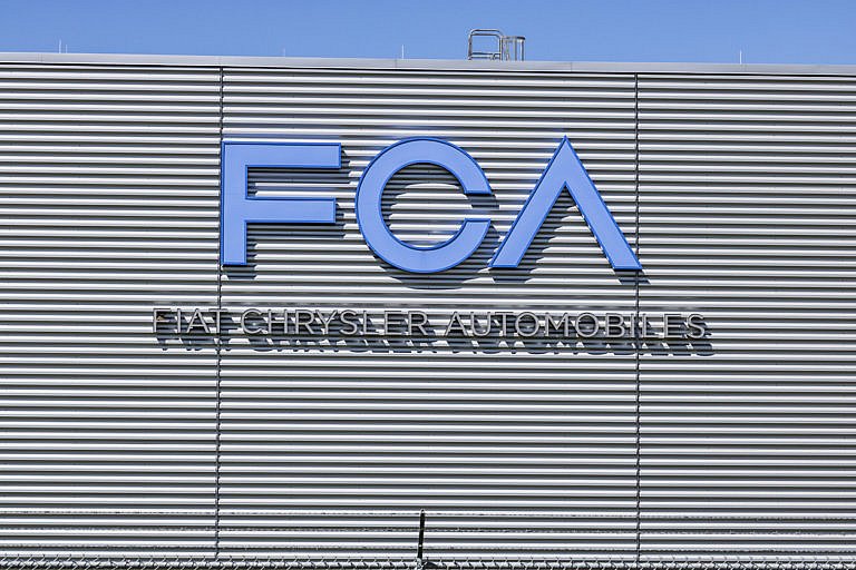 The FCA Fiat Chrysler Automobiles logo on a building.