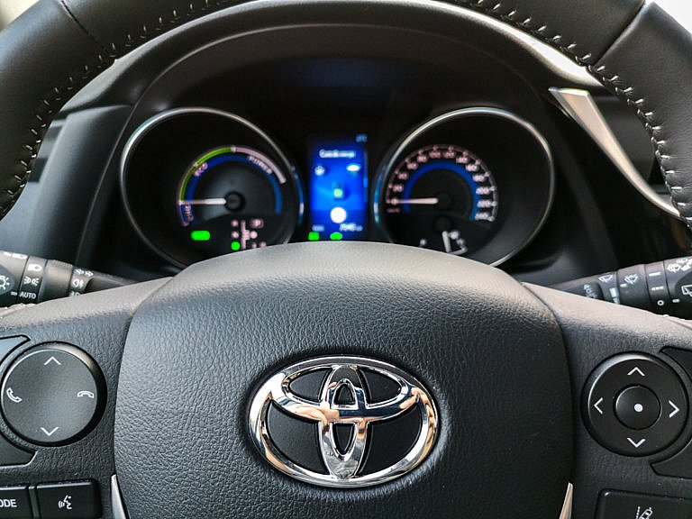 Dashboard and steering wheel of a Toyota car.