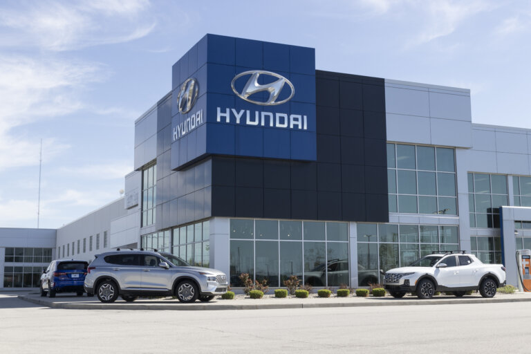 A Hyundai dealership building with cars parked outside.