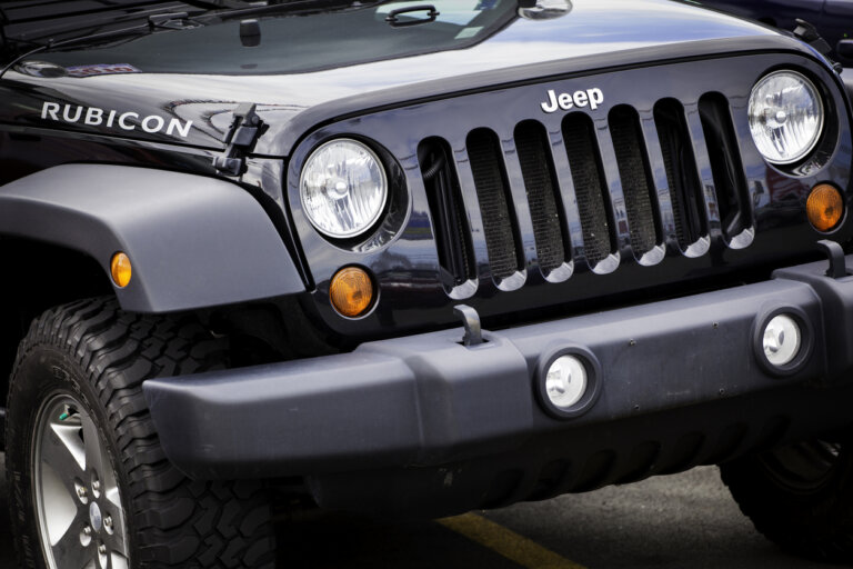 Black Jeep Rubicon front view parked outdoors.