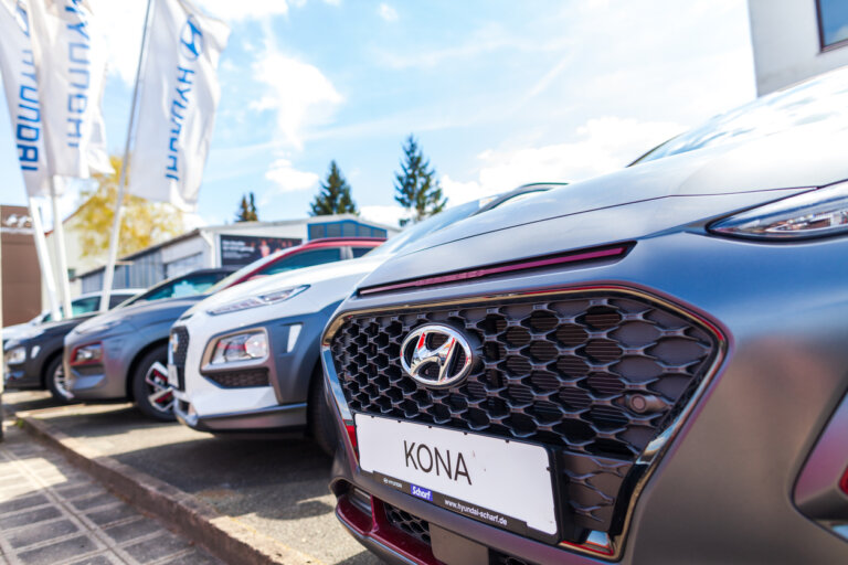 Hyundai Kona cars displayed at a dealership.