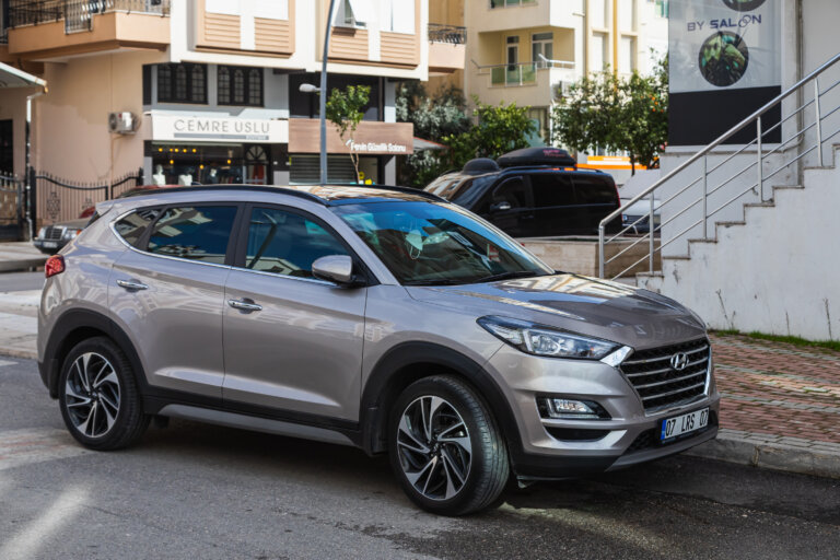 Silver Hyundai SUV parked on a city street