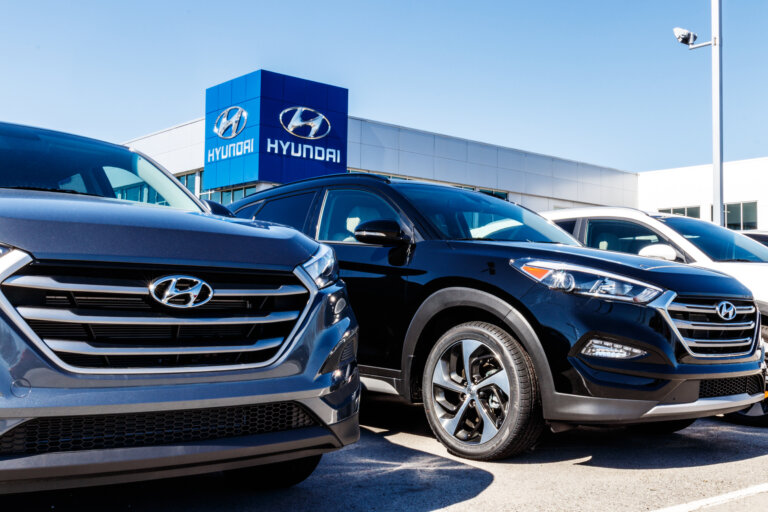 Hyundai dealership with several cars parked in front.
