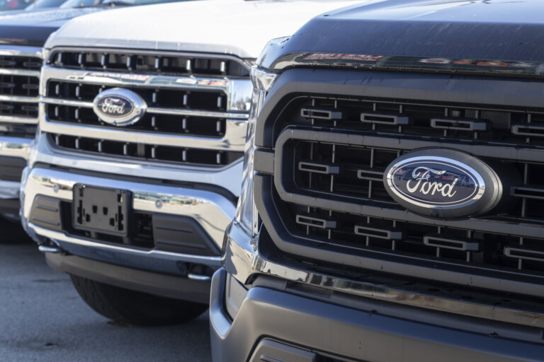 Close-up of Ford truck grilles parked in a row