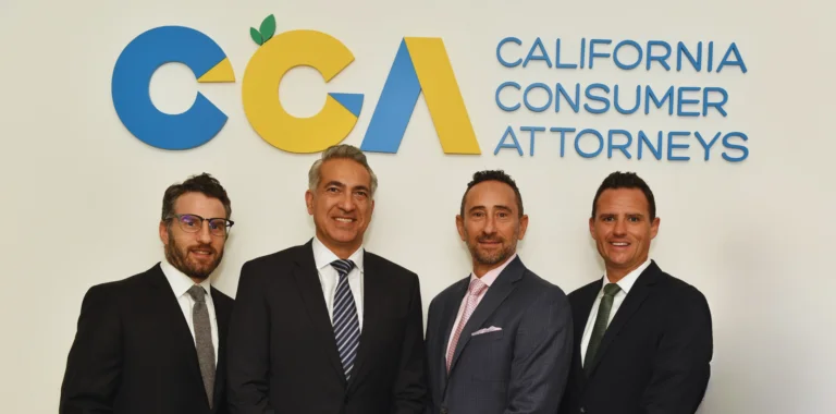Four attorneys posing in front of the California Consumer Attorneys logo.