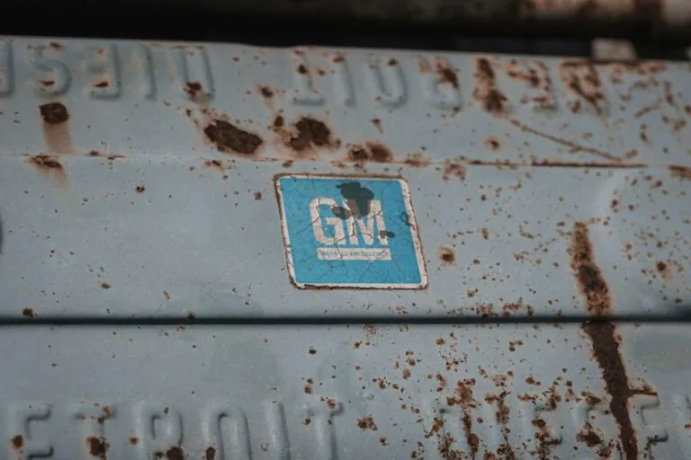 GM badge on a rusted vehicle body