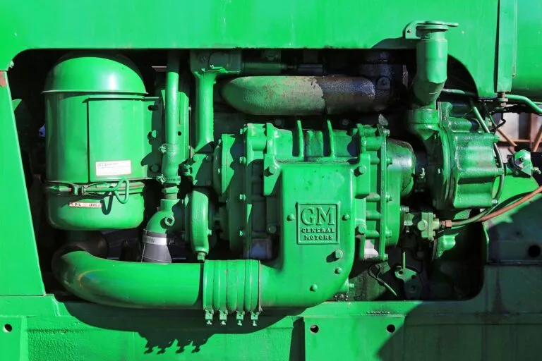 Close-up of a green General Motors engine associated with a lawsuit alleging sudden-failure defects in Buick and Chevrolet vehicles.
